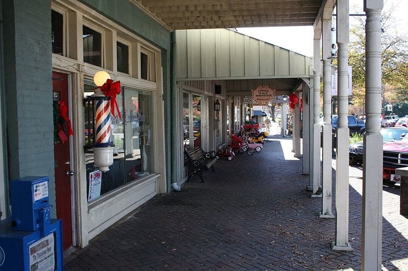 A view of Downtown Northport Alabama, standing in front of the barber shop and looking South toward the river.