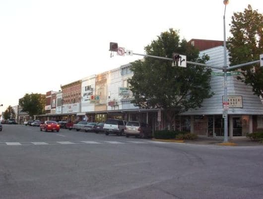 A barbershop, a cafe, and other businesses on the square. Taken in 2004. Kirksville, MO