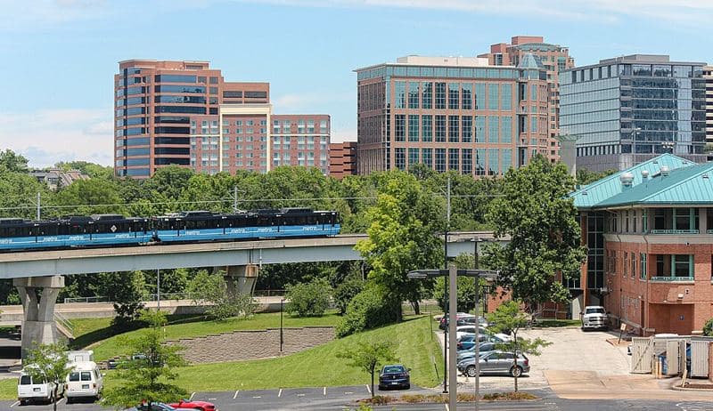 An eastbound Blue Line MetroLink train approaches the Clayton station in suburban Clayton, Missouri.