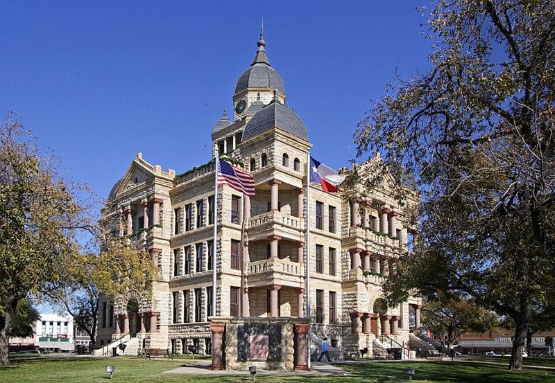 The Denton County, Texas courthouse located at 33.2151° -97.1331°, Denton, Texas, United States. The Romanesque style structure was added to